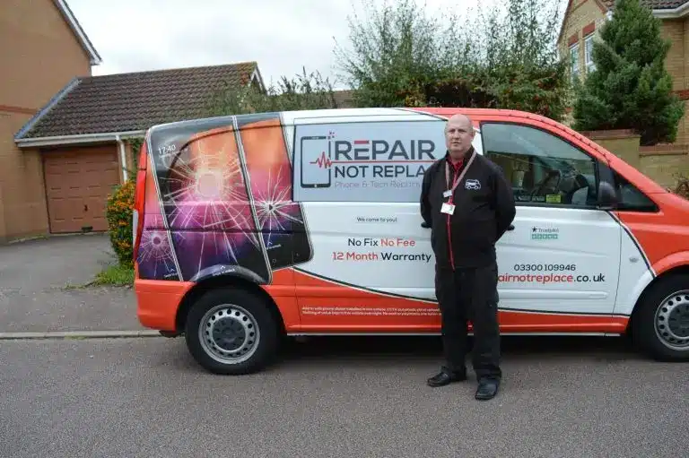 Mark Jones standing in front of Repair Not Replace van