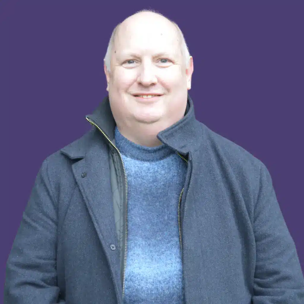 Mark Jones against a purple background