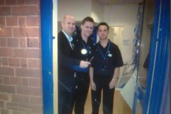 Opening day of O2 Wellingborough, Mark Jones cutting ribbon with two other men